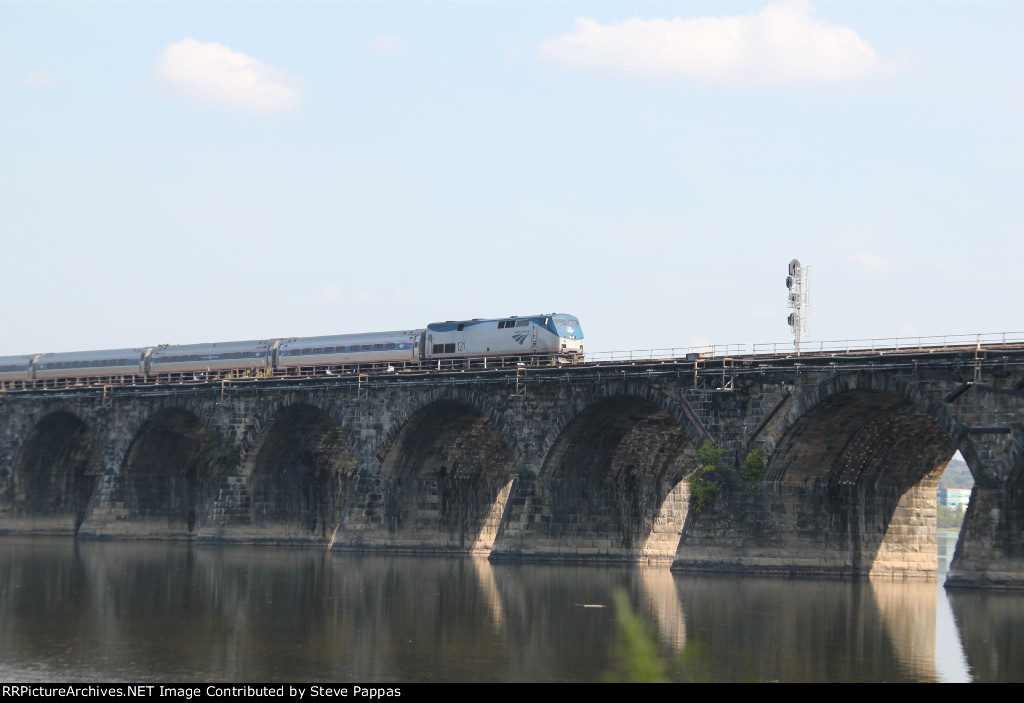 AMTK 121 with the westbound Pennsylvanian on Rockville bridge